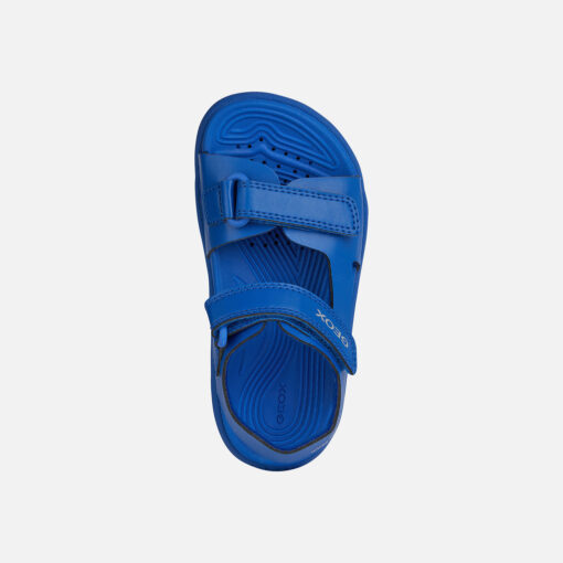 Water-Resistant Junior Sandal Created With Open-Air Adventures In Mind. Cast In A Monochrome Royal-Blue Palette, This Sporty-Looking Piece Of Footwear Is Lightweight, Flexible And Easy To Adjust. Crafted From A Quick-Drying Leather-Effect Material, It Is Set On A Tough Outsole With An Outstanding Grip On Slippery Terrain Too. - Húnar - Ec X20502 50